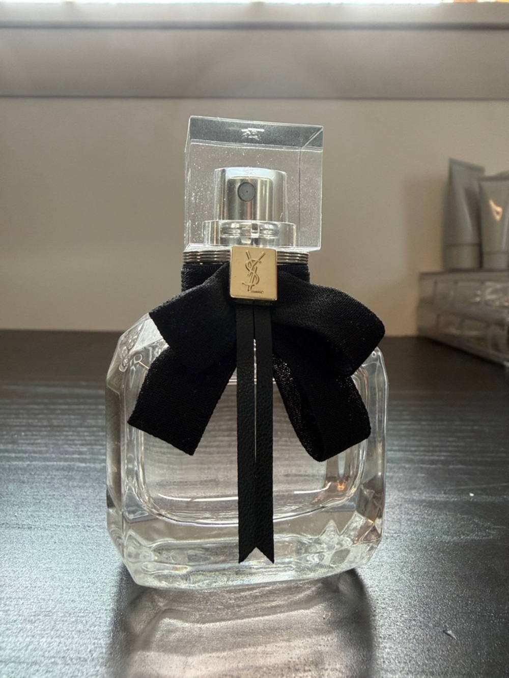 Yves Saint Laurent Clear Glass Perfume Bottle with Black Bow and Gold Accent